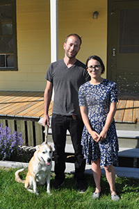 Ryan Blotnick and Keri Kimura with Nori, in front of their new home.