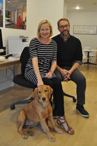 Heli Mesiniemi and Bill Hanley, owners of WMH Architects in Northeast Harbor, Maine, with Sonja the office dog.